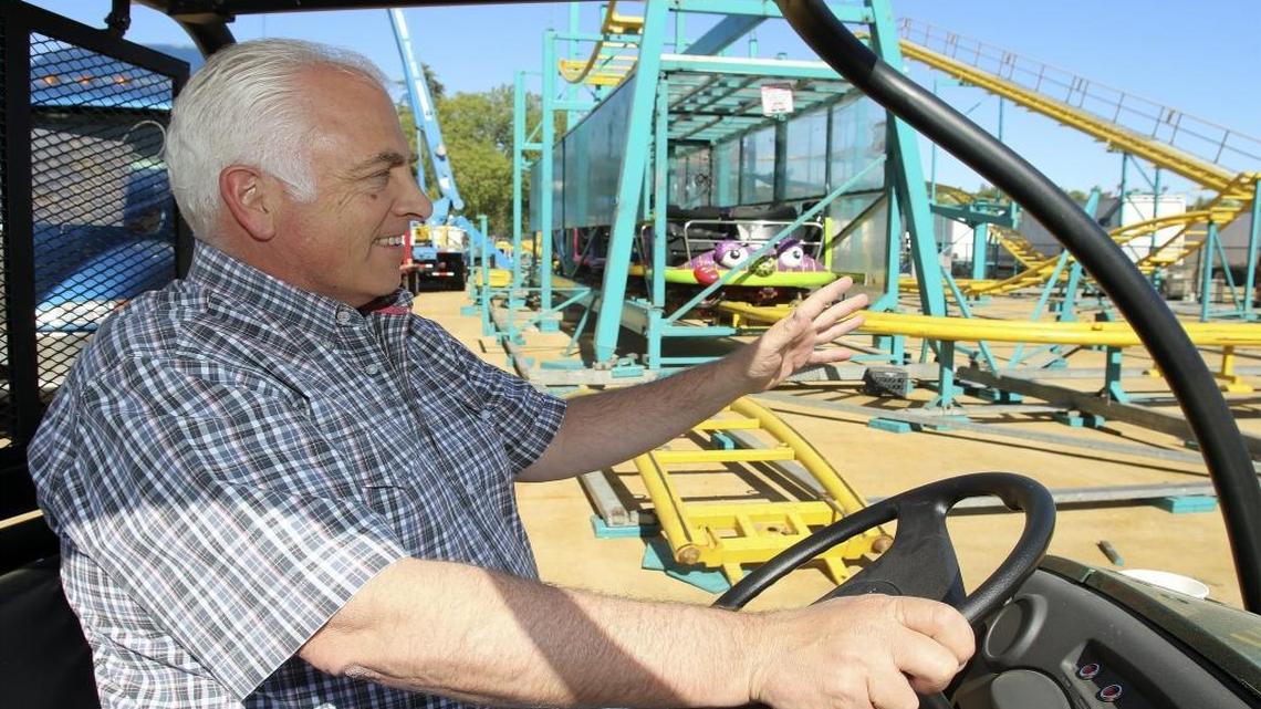 Michael Bradley, the new CEO of the Mid-State Fair, leads a tour of the fair Friday, pointing out work to set up the Crazy Mouse, which he said is the fair’s oldest ride.