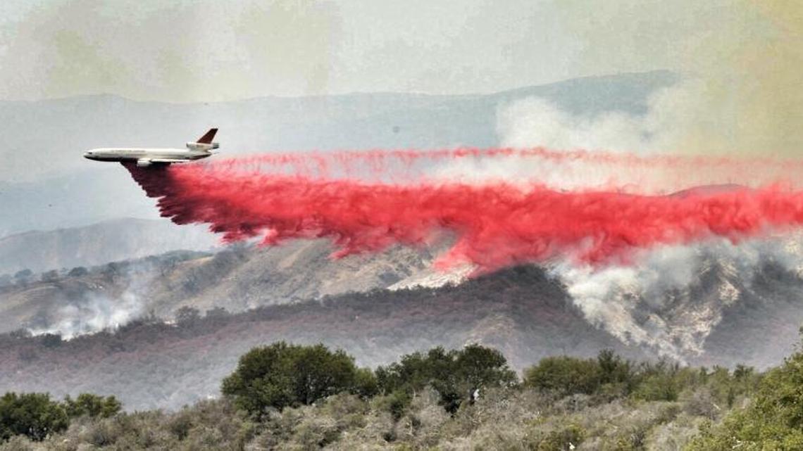 A DC-10 makes a drop on the east flank of the Sherpa Fire Thursday afternoon in Santa Barbara County.