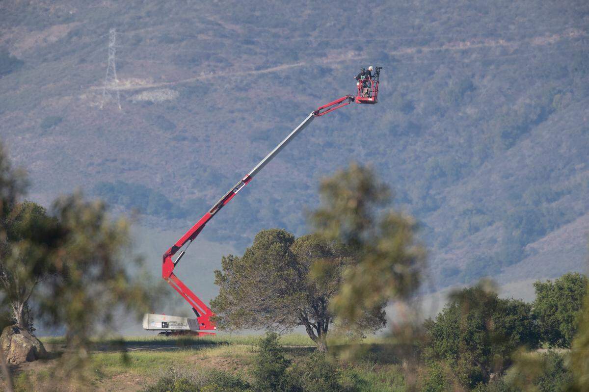 Brian Lawler shoots a panoramic image of San Luis Obispo from atop Terrace Hill on April 17, 2021, recreating a historic image captured by Frank C. Aston in 1930.
