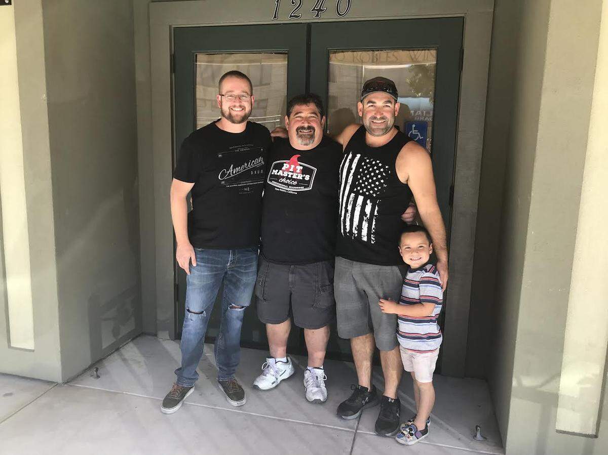 The Steins recently opened a brick-and-mortar restaurant serving their famous barbecue in Paso Robles. Brian Stein (center), runs Stein’s BBQ Co. with his family, Kris Gerkins (left), Aaron Stein and Sawyer Stein (right).
