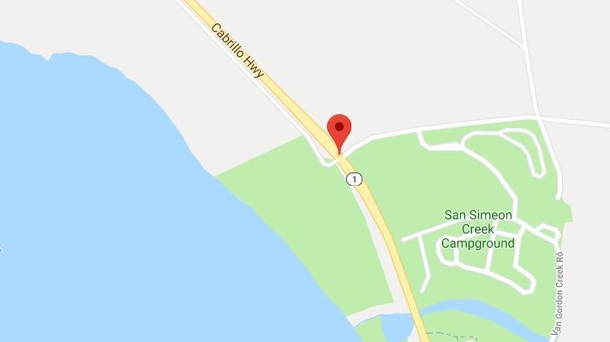 Two people were trapped in a vehicle after it rolled on Highway 1 near San Simeon on Monday morning.