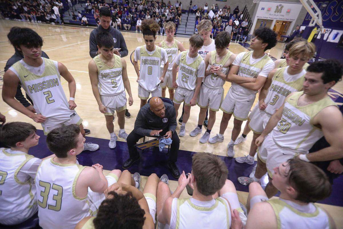 Head coach Terrance Harris had some points to make with his team during a time out in the second half. Mission Prep overcame a first half deficit to finish with a win over Hoover of Fresno, 67-56 in a high school basketball playoff Feb. 20, 2024.
