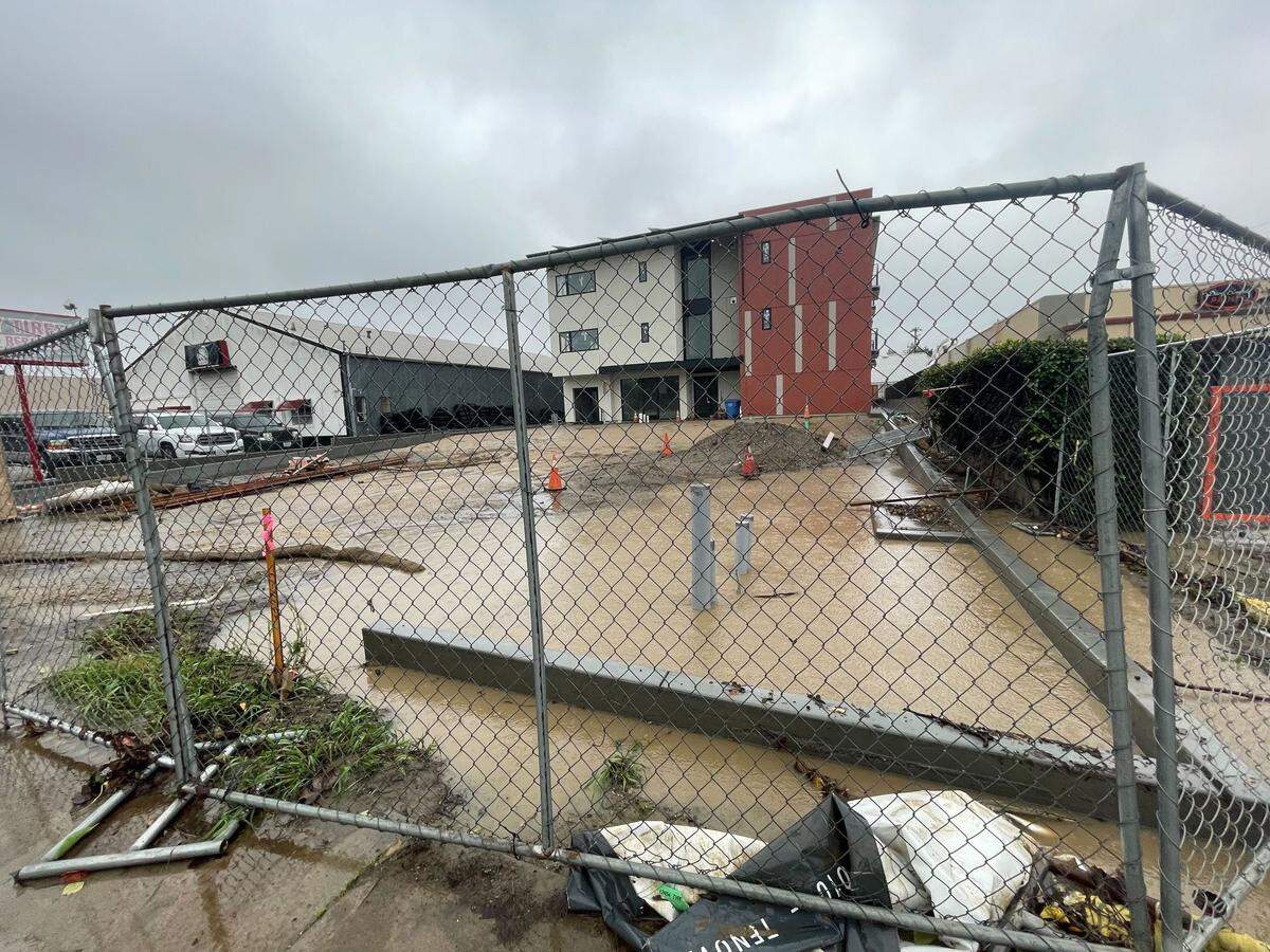 Business along South Higuera Street had flooded parking lots and many were covered in mud from the sudden onslaught of water on Jan. 9 2023.