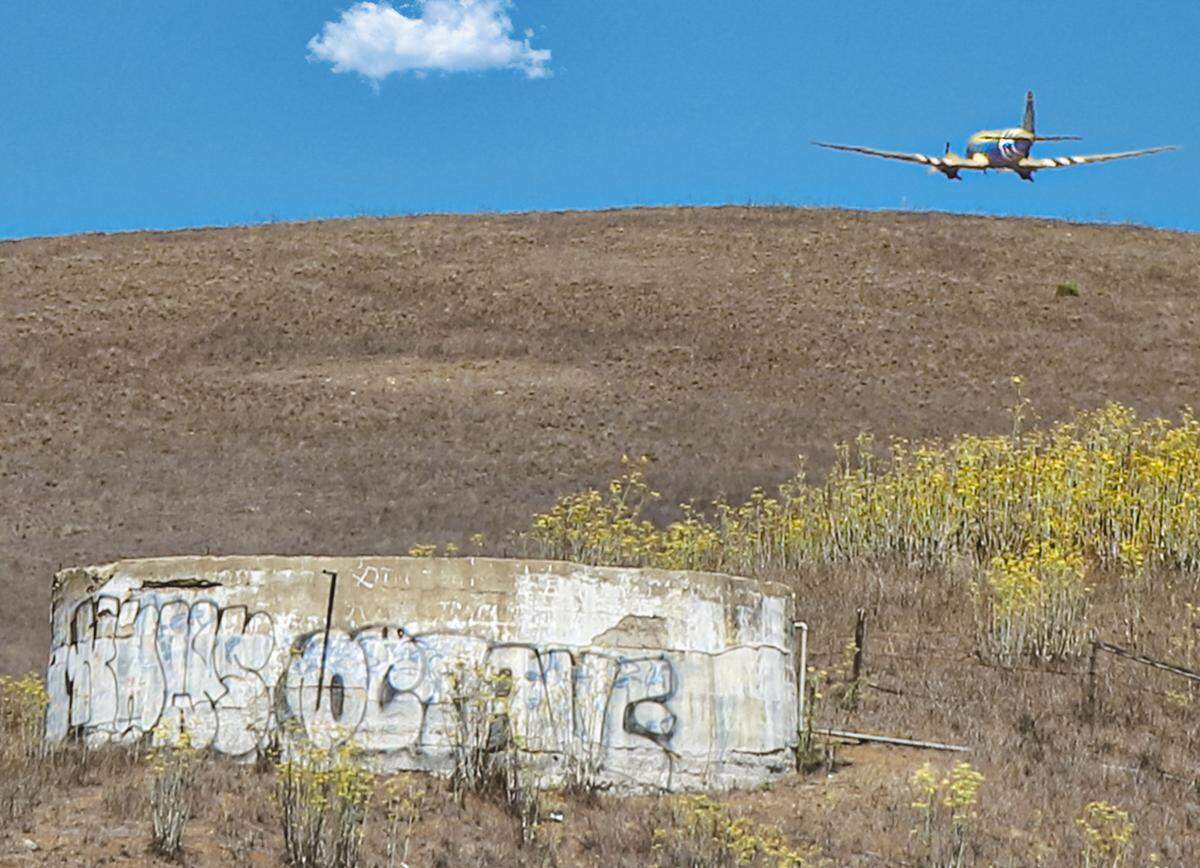 The C-47 Betsy’s Biscuit Bomber flies over Cayucos on Saturday, Aug. 28, 2022, during an Honor Flight from Paso Robles to the coast for 17 veterans.