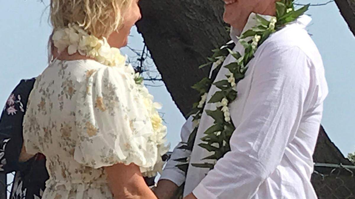 Bride Jenny Hayes and groom Sean Tanner, son of columnist Kathe Tanner, share a gentle laugh during their wedding ceremony at the Ragged Point Resort on July 16, 2022.
