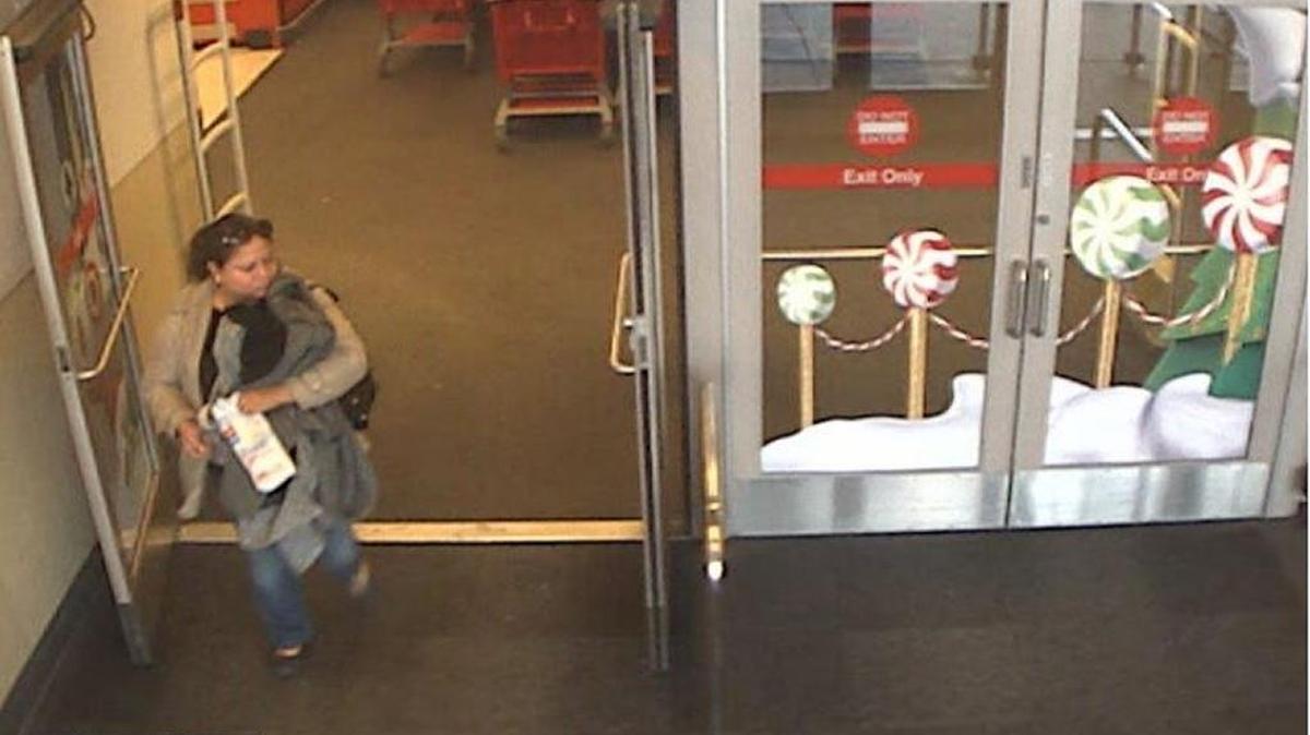 Security footage from Target shows a woman police believe stole a bag of rings dropped by another customer on Dec. 7, 2016.