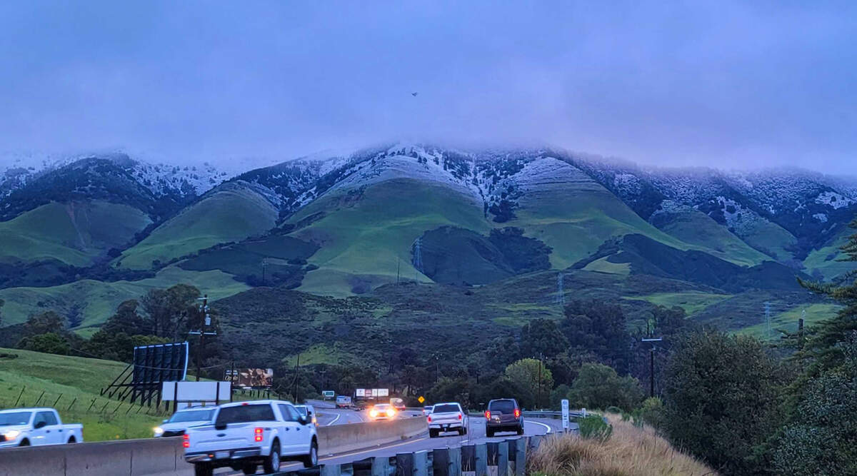 Snow was visible on the hills above the Cuesta Grade in San Luis Obispo on Saturday morning, Feb. 25, 2023.