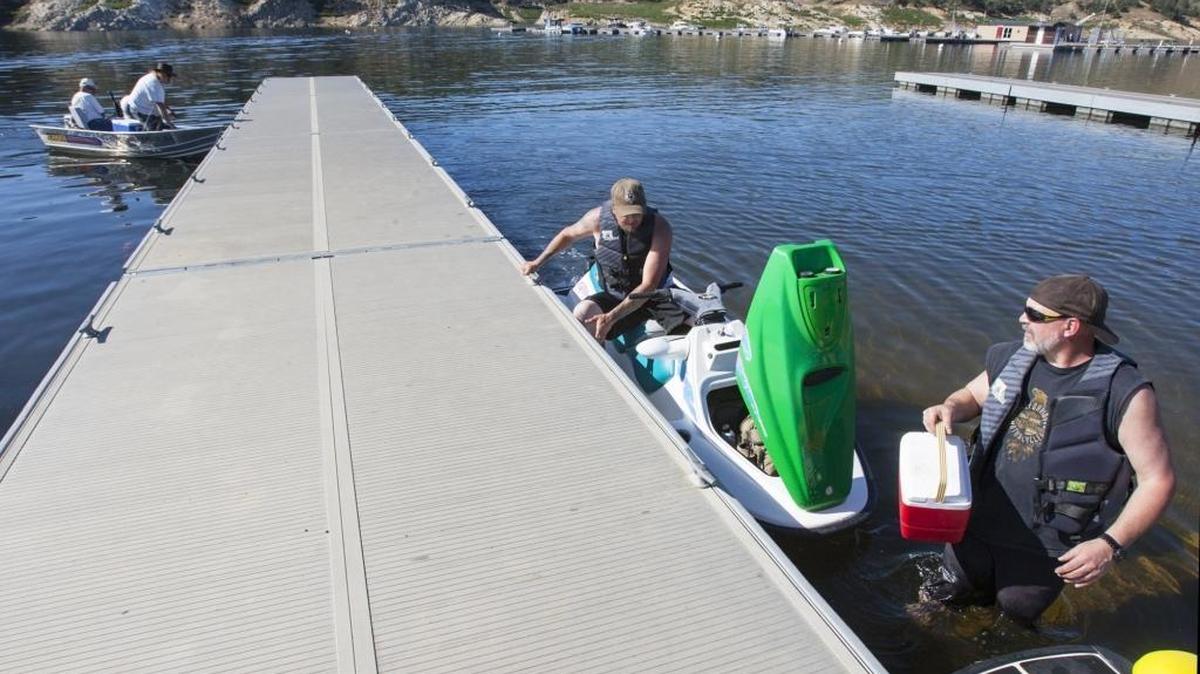 David Manning, right, and Sheldon Eagleking prepare to go out on Nacimiento Lake on Tuesday. Because of its immense watershed and location, the reservoir has seen the largest gains of any of the major lakes in the county. The last reading was at 35 percent of capacity as of Thursday.