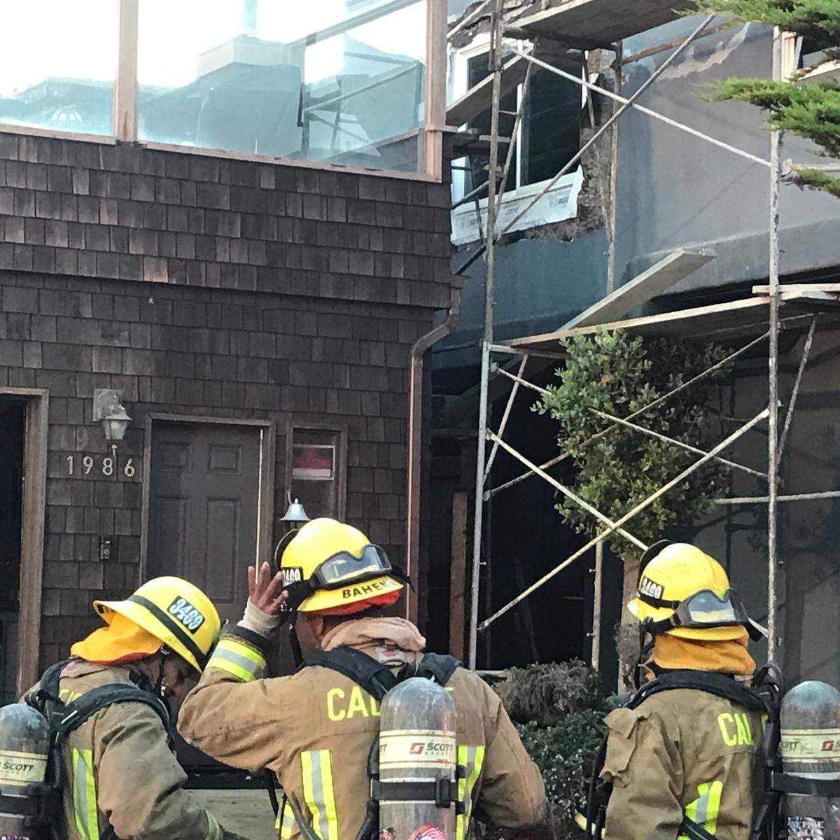 An early-morning fire started in the wood-shingle sided home on the left, but spread to part of the adjacent house on Sherwood Drive in Cambria on Thursday, Oct. 20, 22.