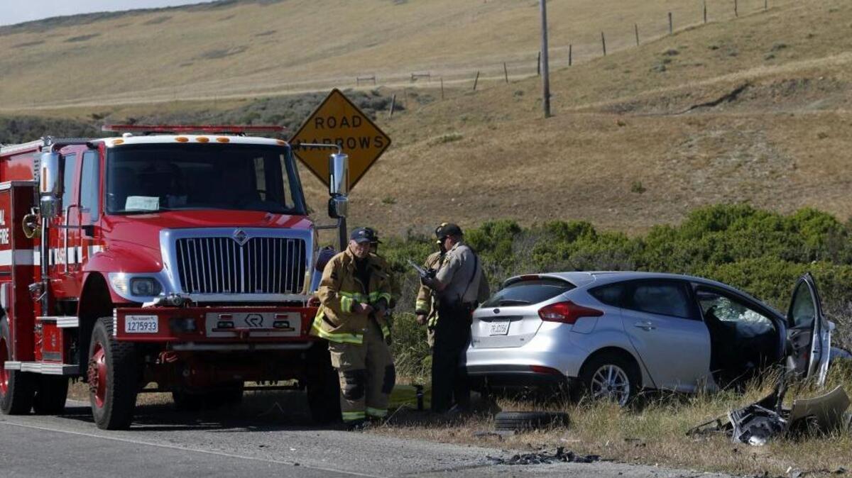 CHP and Cal Fire responders investigate the scene of a two-car head-on collision Wednesday afternoon on Highway 1 just north of Piedras Blancas. One person was killed and three injured in the crash.