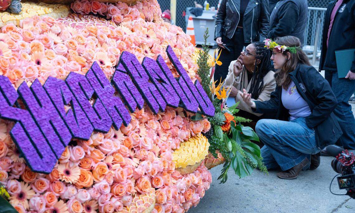 People inspect Cal Poly’s rose float at the Pasadena Rose Parade on Jan. 1, 2024.