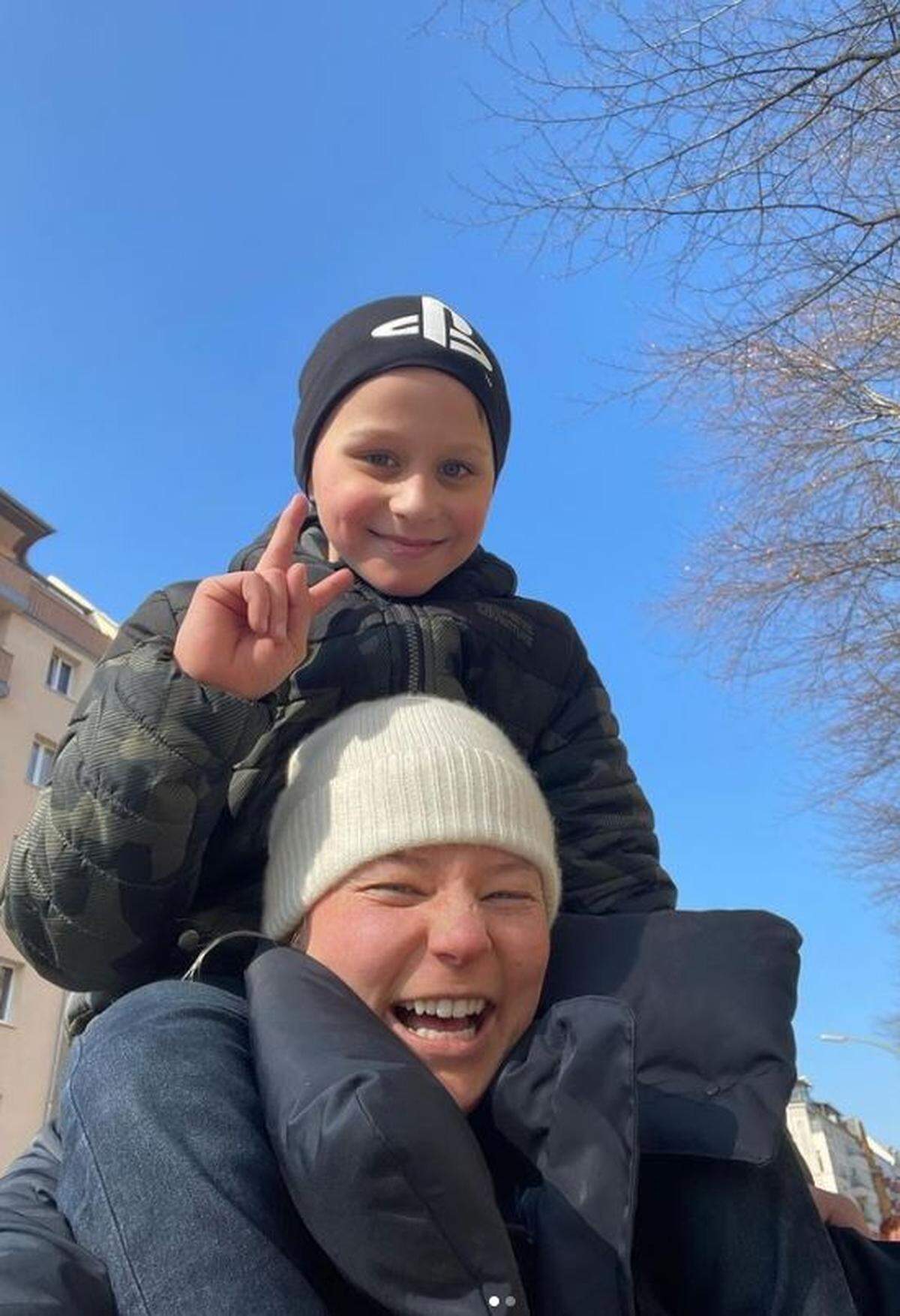 Sophia Kardel carries Max on her shoulders. He’s one of three children from a Ukrainian refugee family Kardel helped escape to Germany.
