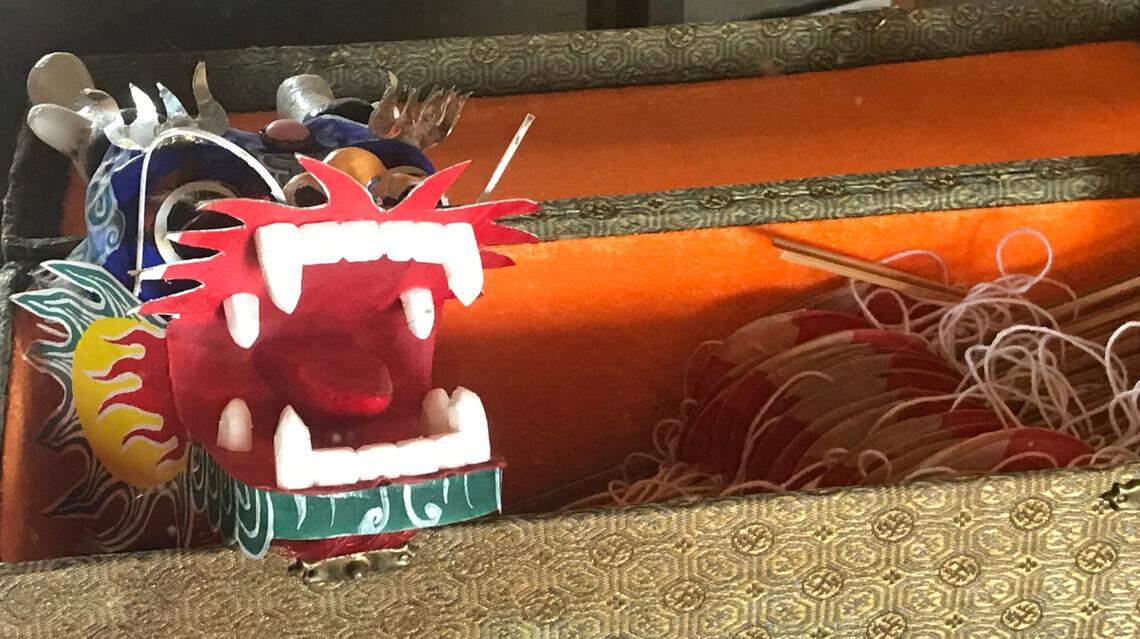 This comically fearsome little dragon is one of the Chinese artifacts displayed in a glass case at the historic Mee Heng Low restaurant in San Luis Obispo.