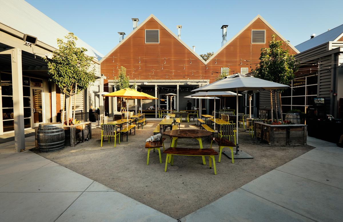 An outdoor seating area stands between SLO Brew’s new concert venue and SLO Brew Rock in San Luis Obispo.