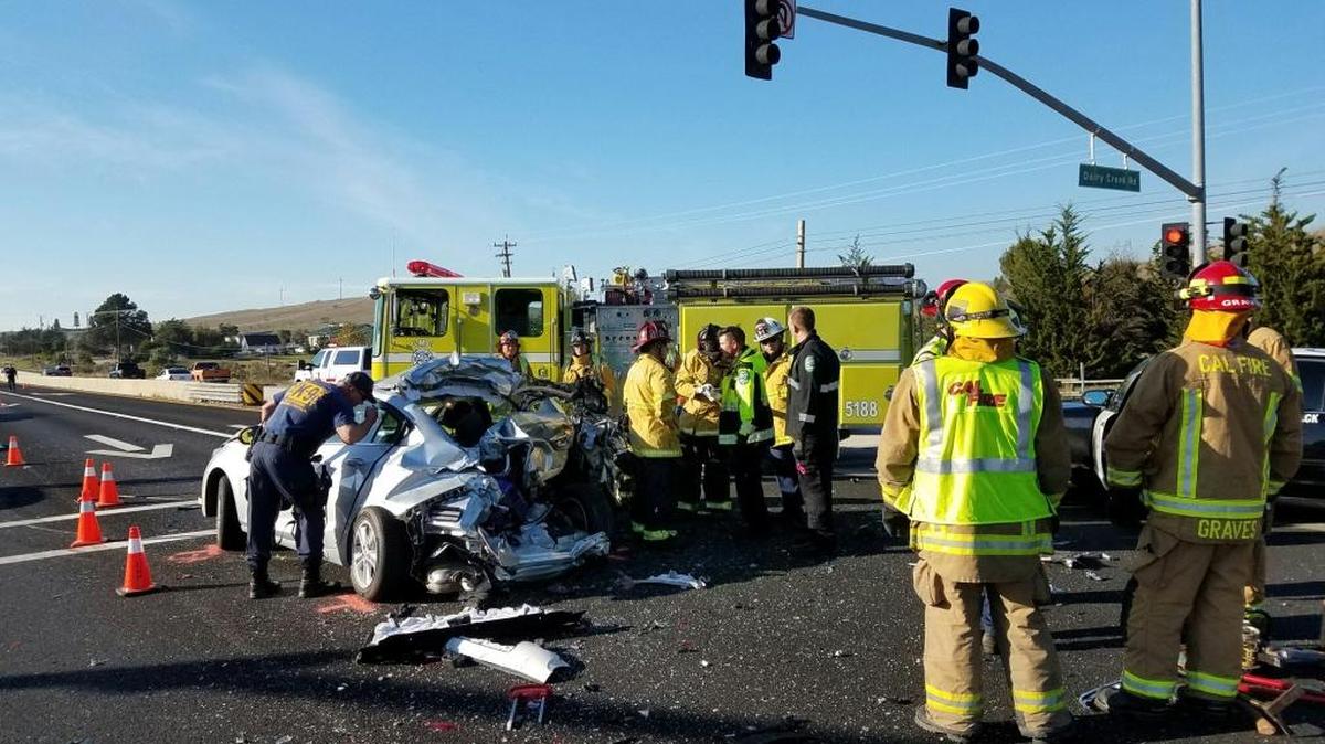 Cal Fire crews respond to the scene of a vehicle collision near Cuesta College that killed one person and injured three others.