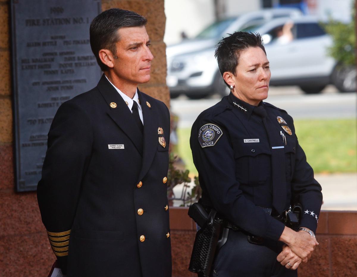 Fire Chief Garret Olson and Police Chief Deanna Cantrell listen during the ceremony in memory of the first responders lost in the 2001 Sept. 11 attacks.