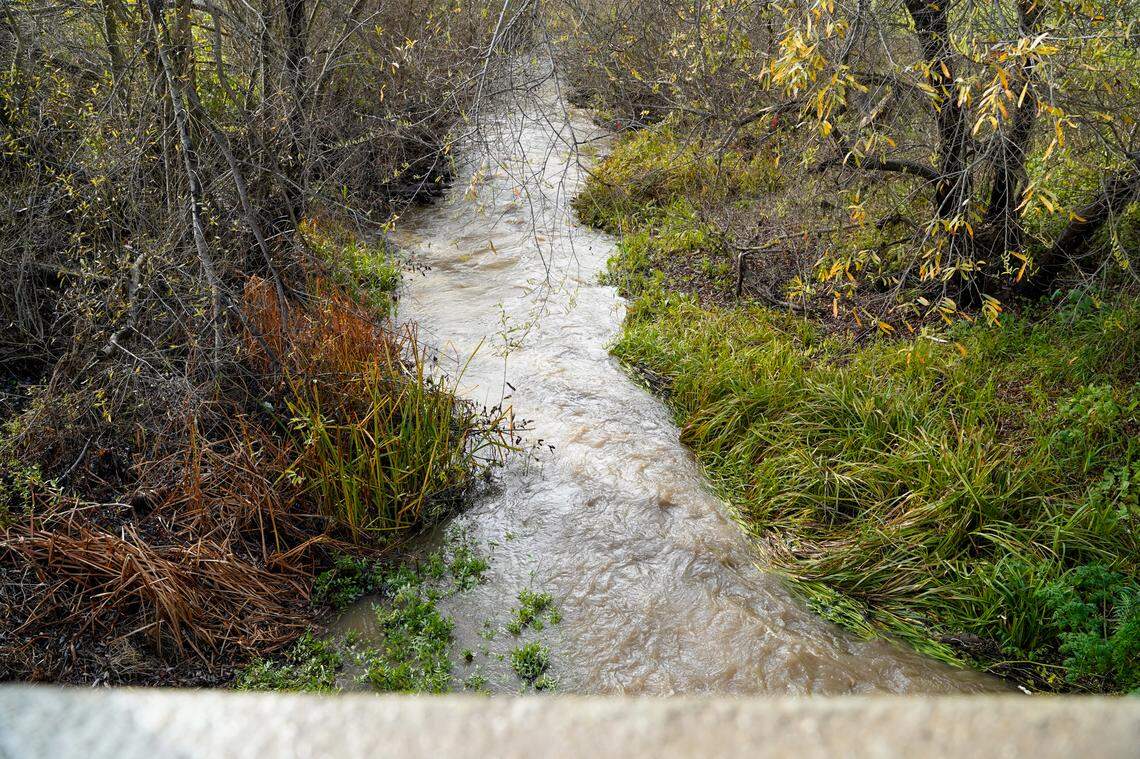 Water flowing in the Arroyo Grande Creek levee on Feb. 13, 2025, as an atmospheric river storm drenches San Luis Obispo County. 