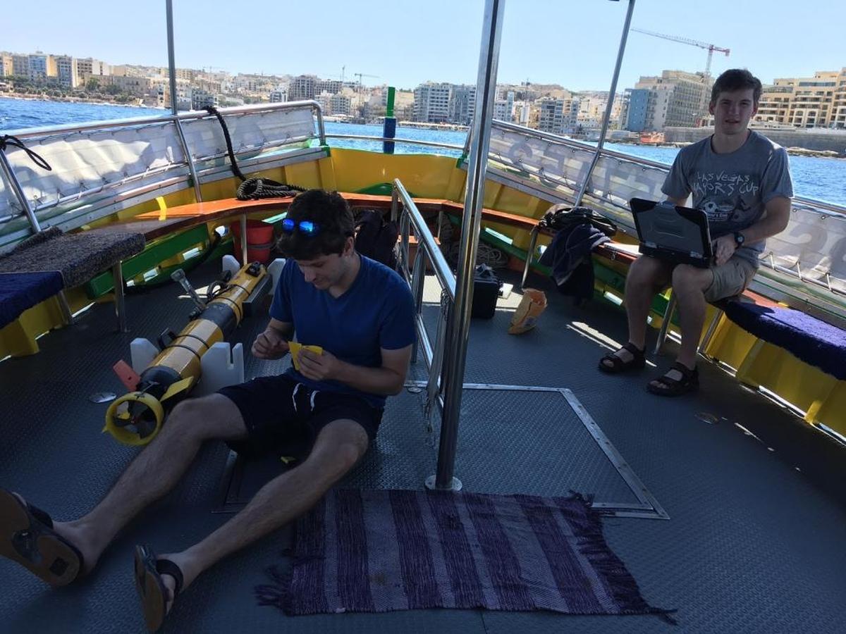 Cal Poly computer science student Sam Freed and Harvey Mudd computer science student Jeff Rutledge get ready to embark on an expedition to map underwater objects off Malta.
