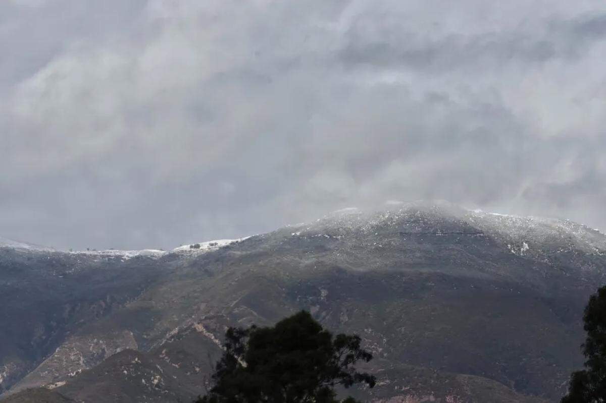 A dusting of snow along the top of the Santa Ynez Mountain above Goleta on Sunday morning, Jan. 26, 2025.
