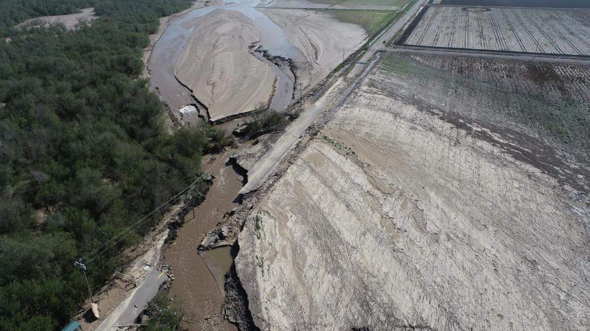 A drone photo shows how the Santa Maria River washed out the entrance road to Rancho Guadalupe Dunes park’s entrance.