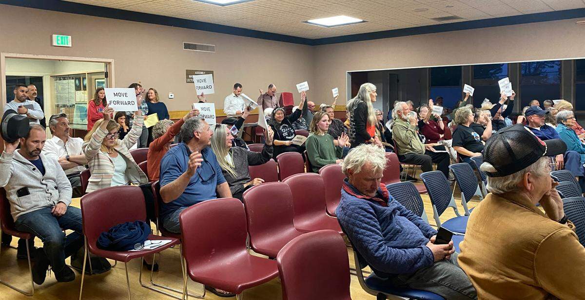 The Morro Bay City Council discussed the roundabout proposed for the Main Street, Highway 1 and Highway 41 intersection at a meeting May 27, 2025. Audience members flashed signs that said “move forward,” urging the City Council to support the project.