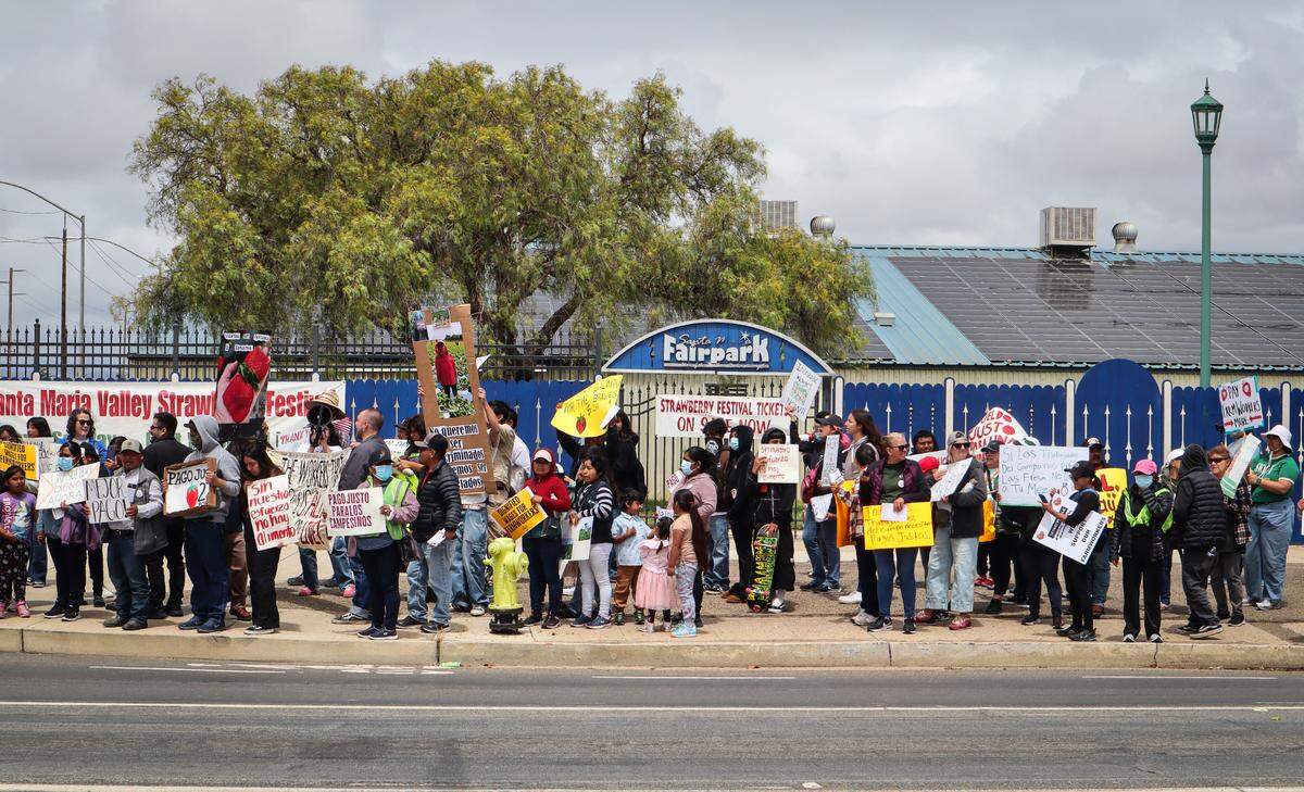 About 80 people protested the Santa Maria Strawberry Festival on April 27, 2025. They called for the Santa Barbara County Board of Supervisors to set a $26 per hour minimum wage for farmworkers.