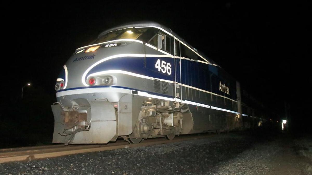 A northbound Amtrak train involved in a fatality waits on the tracks north of the accident scene while the investigation continued Saturday night.