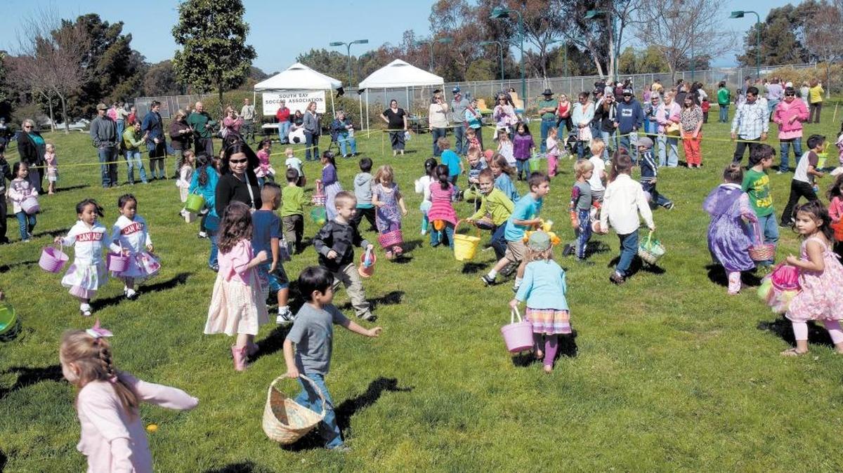 File photo of kids and parents enjoying an Easter egg hunt at the Los Osos Community Center.