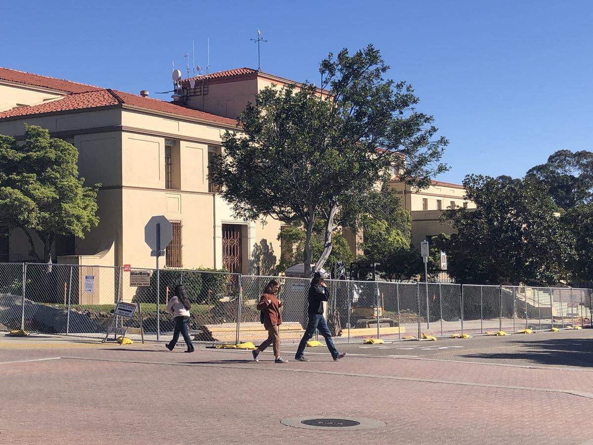 An area of San Luis Obispo’s downtown on Osos Street has been fenced off as part of work on a bus transit center. The work has been put on hold pending investigation of potential historical artifacts.
