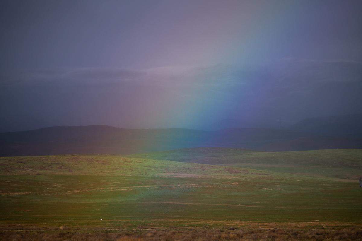 A rainbow rises in the California Valley on Wednesday, Feb. 22, 2023, near the Carrizo Plain as a cold winter storm moves into California.