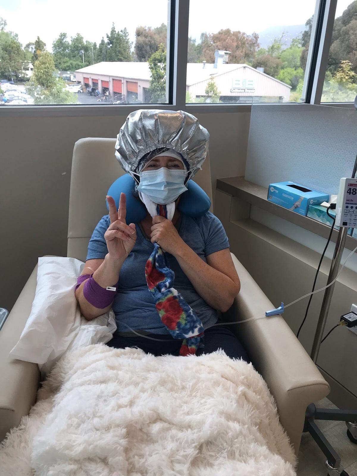 Lisa Lazzara of San Luis Obispo wears her cold cap during her chemotherapy infusion. Cold caps helped her prevent hair loss from the treatment for breast cancer.