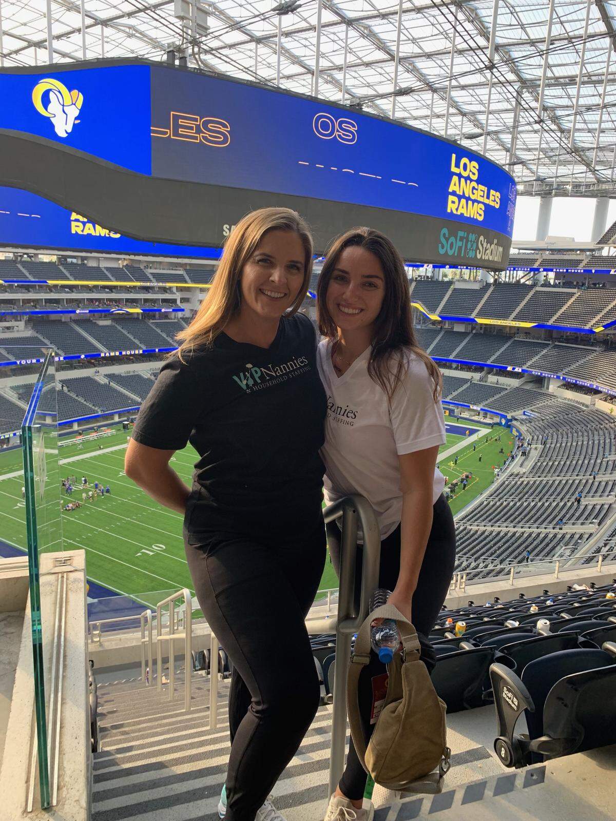 Rebecca Stewart, left, poses for a photo with one of her employees at SoFi stadium. Stewart, a 1999 San Luis Obispo High School grad, owns VIP Nannies and Household Staff. Her company cares for children of Los Angeles Rams players and will be working during the Super Bowl. 