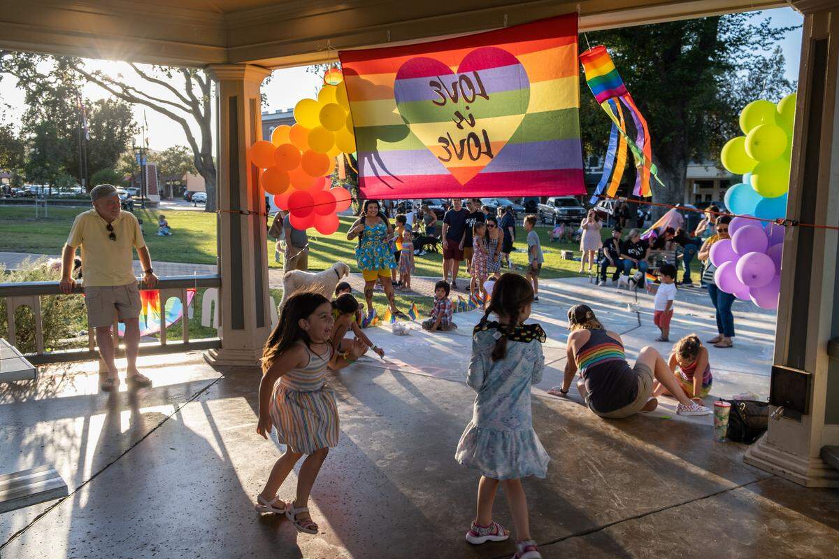 Kids dance during the first-ever Paso Pride in downtown Paso Robles on June 24, 2022.