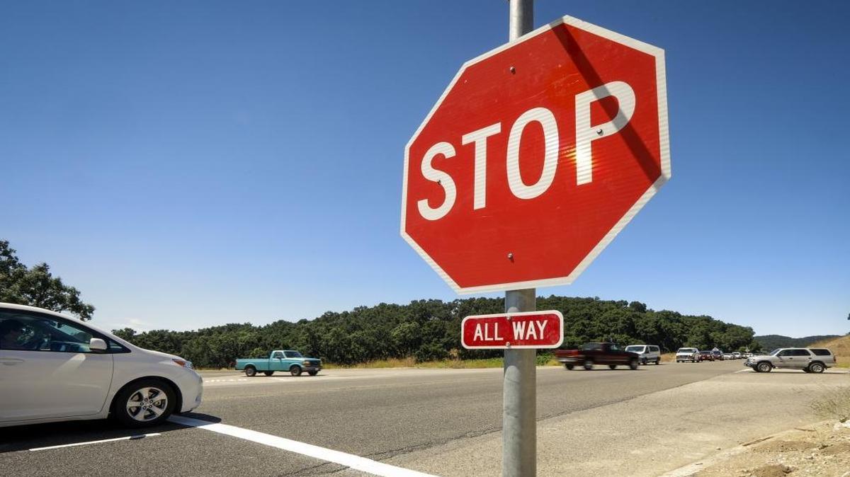 Is it legal to roll through a stop sign in Kentucky if the intersection is clear? Here’s what the law says.