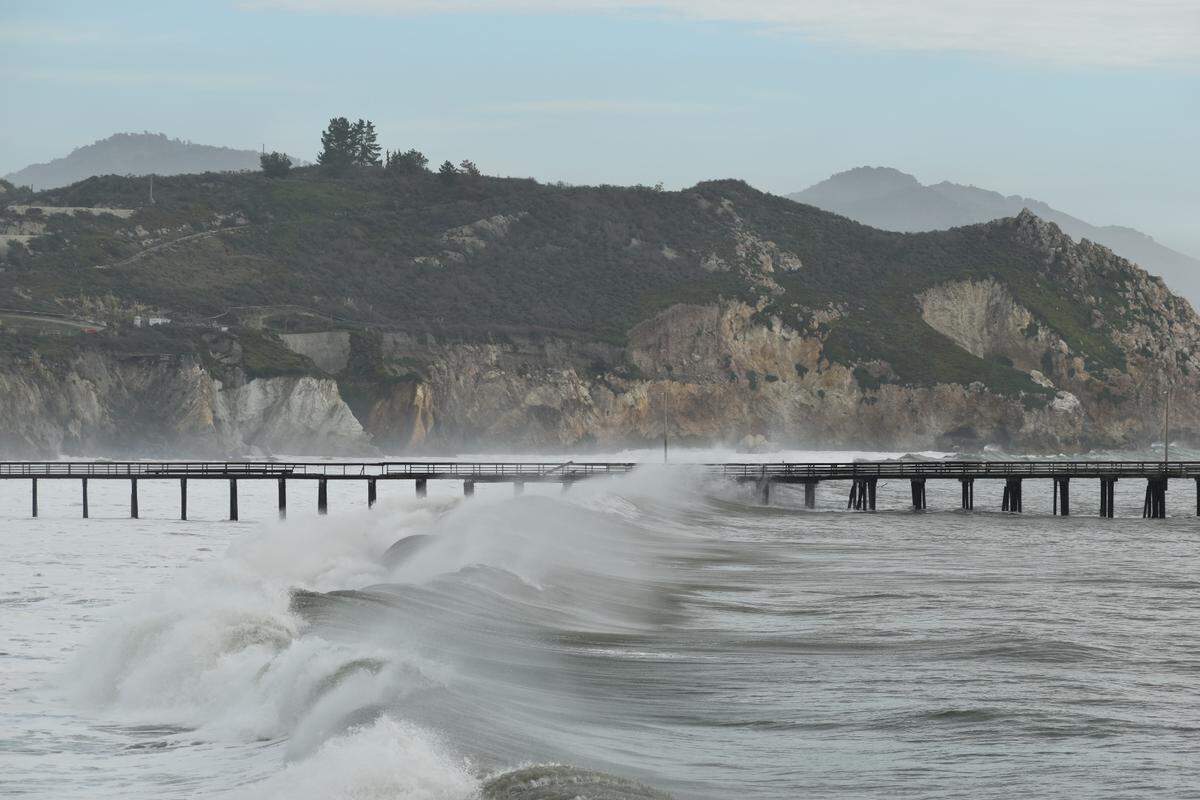 Large waves hammer the Avila Beach Pier on Thursday, Dec. 29, 2023.