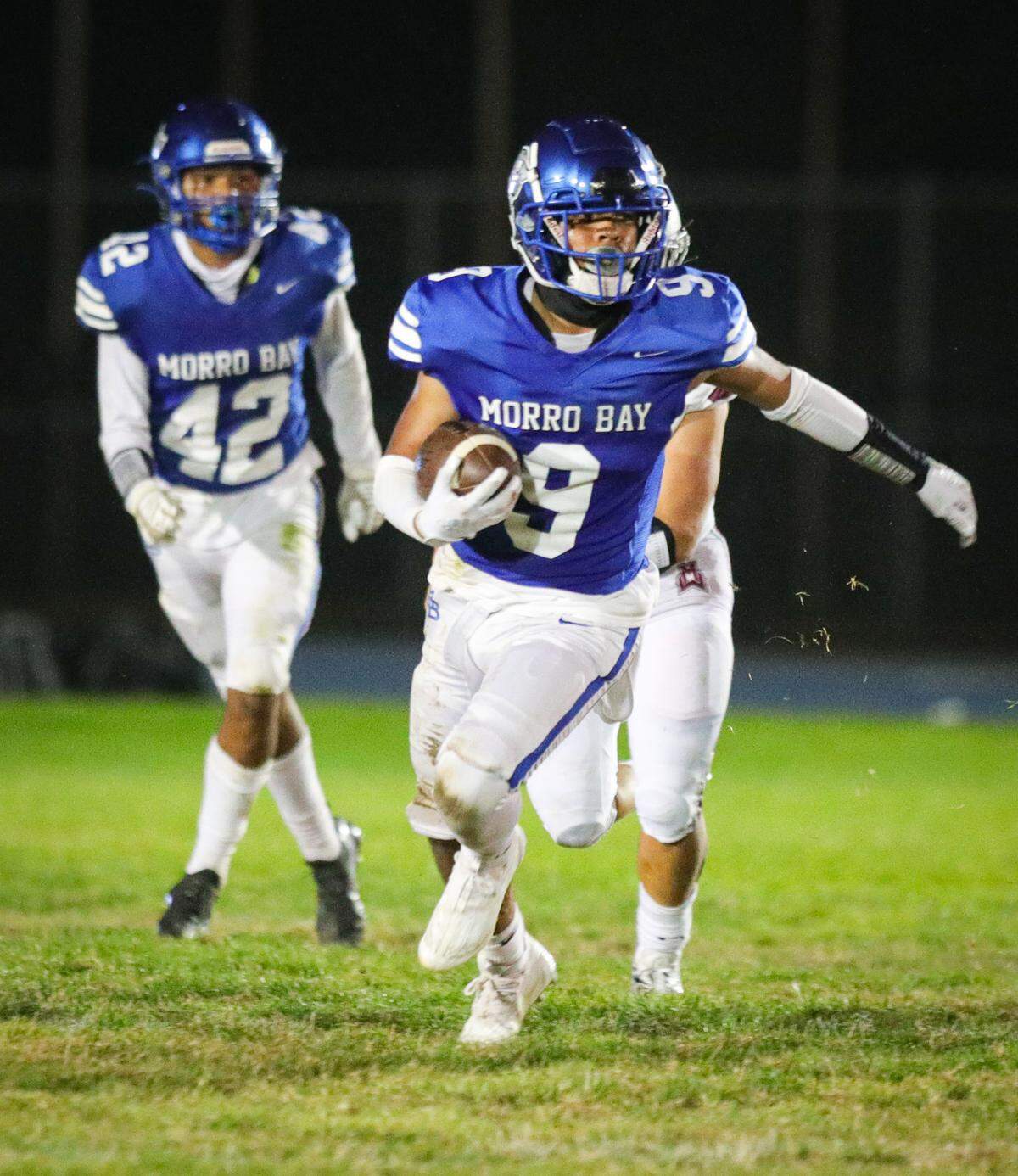Efrain Hernandez runs down field followed by Manny Diaz. Morro Bay hosted Mt. Whitney High School for week two of the football season.Aug. 25, 2023. The Pirates fell to the Pioneers 28-16.