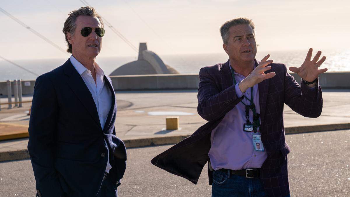 California Gov. Gavin Newsom, left, listens to Tom Jones, PG&E’s director of government relations, during a tour of Diablo Canyon nuclear power plant in Avila Beach on March 1, 2023.