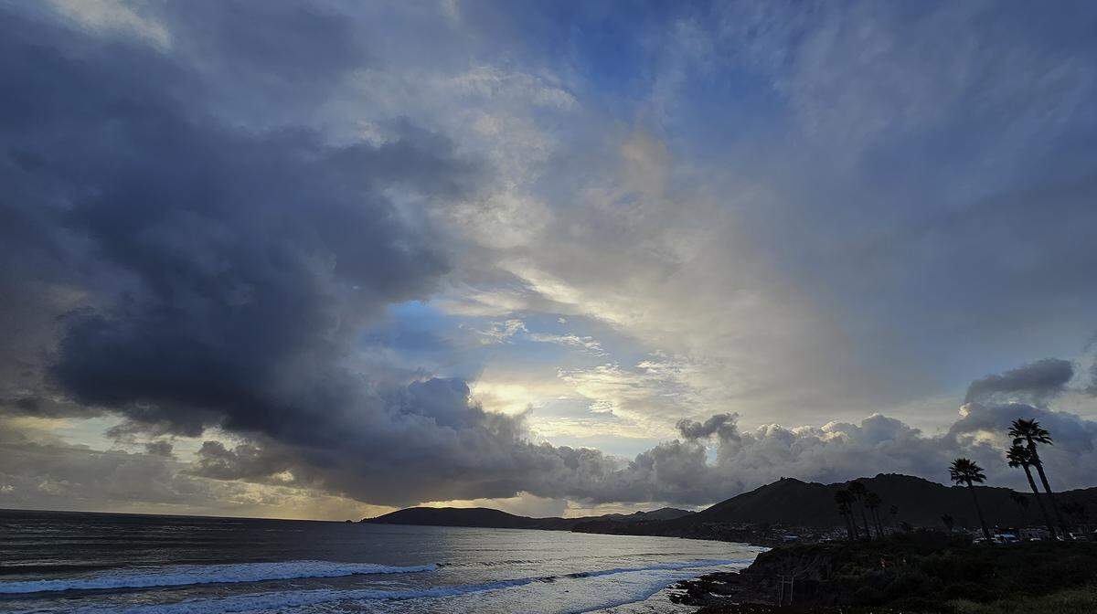 A sunset seen from North Silver Shoals Drive in Pismo Beach after scattered showers on Saturday, March 23, 2024.