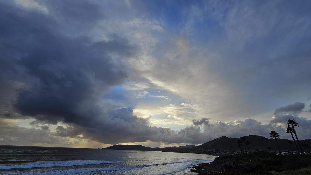 A sunset seen from North Silver Shoals Drive in Pismo Beach after scattered showers on Saturday, March 23, 2024.