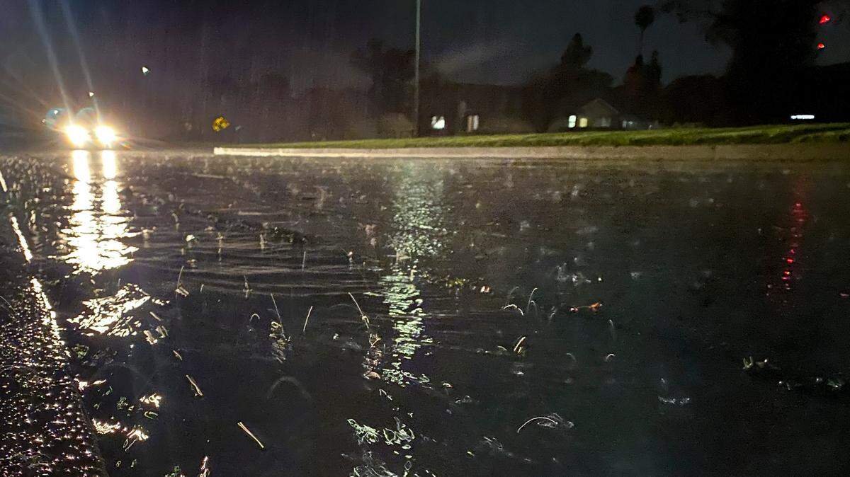 Rain falls past a streetlamp on Junipero Way in San Luis Obispo on March 12, 2025.