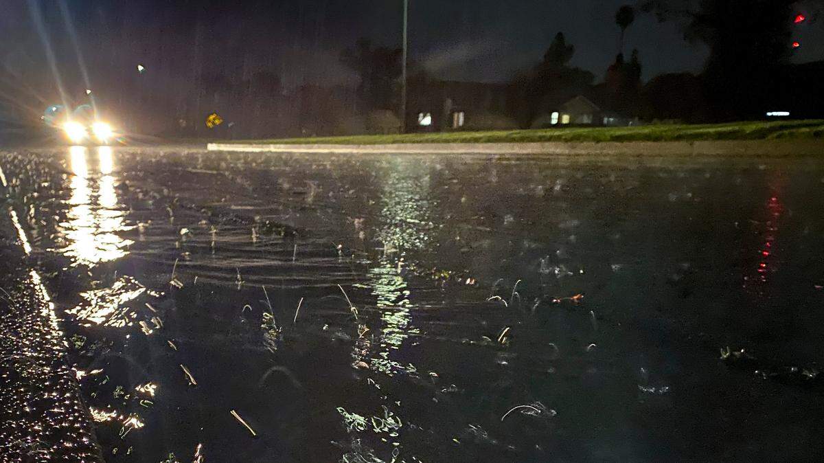Rain falls past a streetlamp on Junipero Way in San Luis Obispo on March 12, 2025.