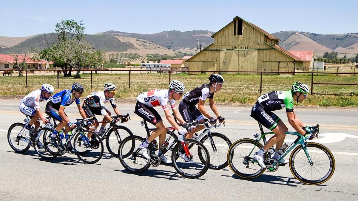 A group of cyclists ride down North Thompson Avenue in Nipomo during stage 5 of the Amgen Tour of California in May, when Pismo Beach and Avila Beach served as host cities.