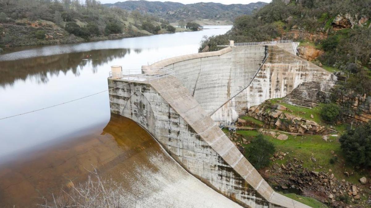 Water falls through the Salinas Dam spillway after Santa Margarita Lake filled for the first time in years in February.