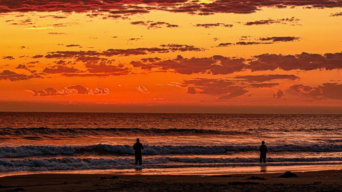 Fishermen enjoy a sunset near Morro Bay in September 2024.