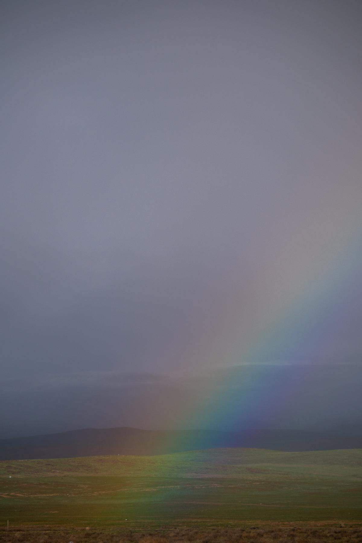 A rainbow rises in the California Valley on Wednesday, Feb. 22, 2023, near the Carrizo Plain as a cold winter storm moves into California.