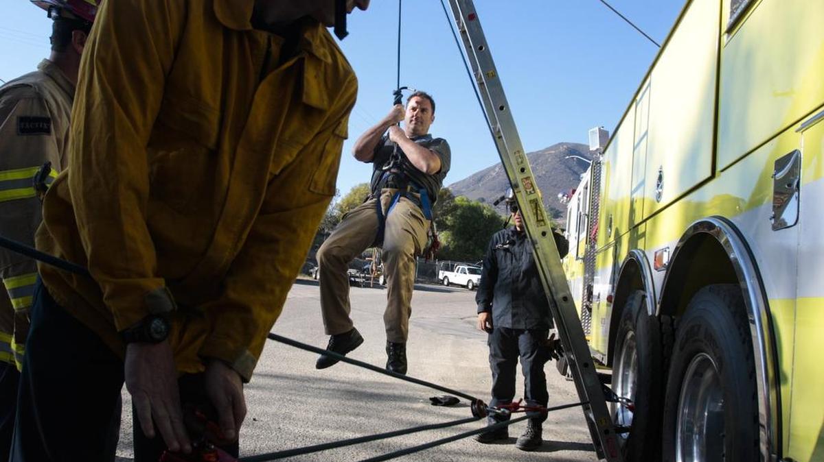 San Luis Obispo firefighter-paramedic James Witt and Capt. Mark Vasquez (hidden at left) lift San Luis Obispo police Sgt. Fred Mickel during a water rescue exercise. San Luis Obispo Fire Capt. Armando Gutierrez (behind ladder) was in charge of some recent training on swift-water rescues for local police and fire departments. The forecast wet El Niño year has local agencies preparing.