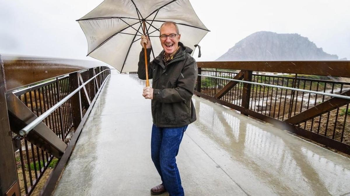 Morro Bay Mayor Jamie Irons enjoys a rainy day on the city’s new Multi-Use Trail and Bridge that connects north Morro Bay with the downtown waterfront.