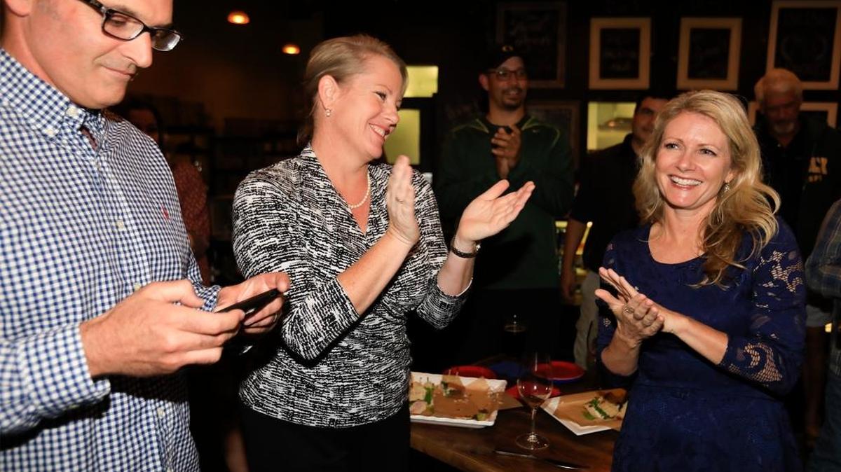 Caren Ray and Kristen Barneich watch the first results appear in Arroyo Grande.