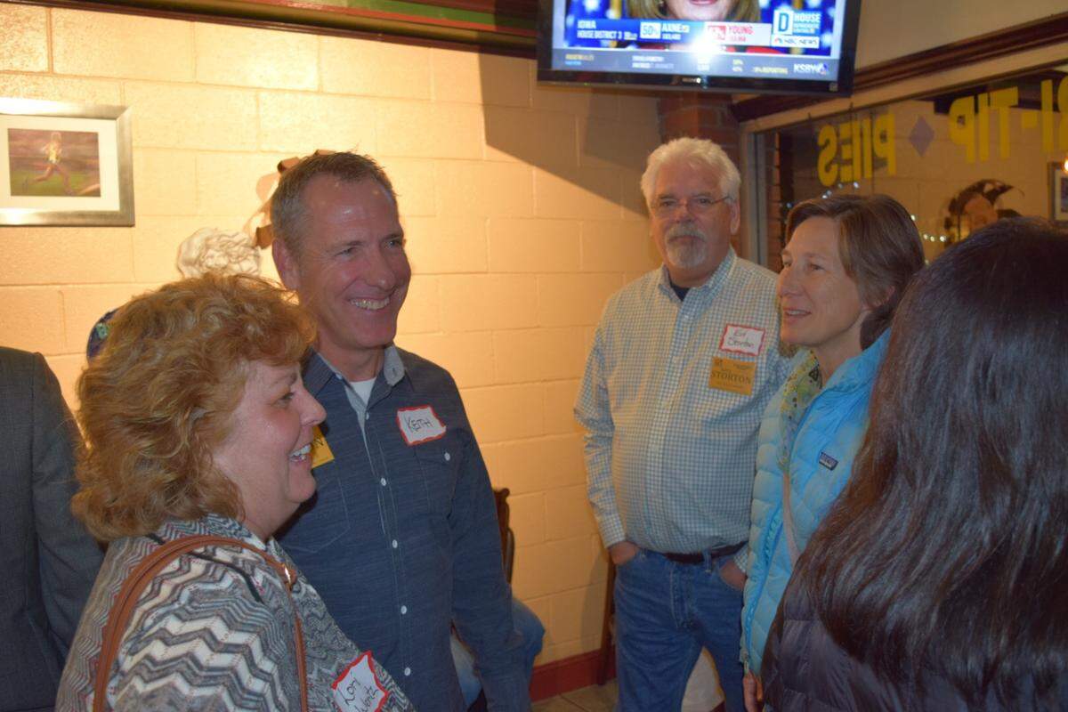 Keith Storton, second from left, talks to supporters Tuesday night at Branch Street Deli in the Village of Arroyo Grande. Storton is running for a seat on the Arroyo Grande City Council, along with Jimmy Paulding, Coleen Kubel, John Mack and Terry Fowler-Payne.