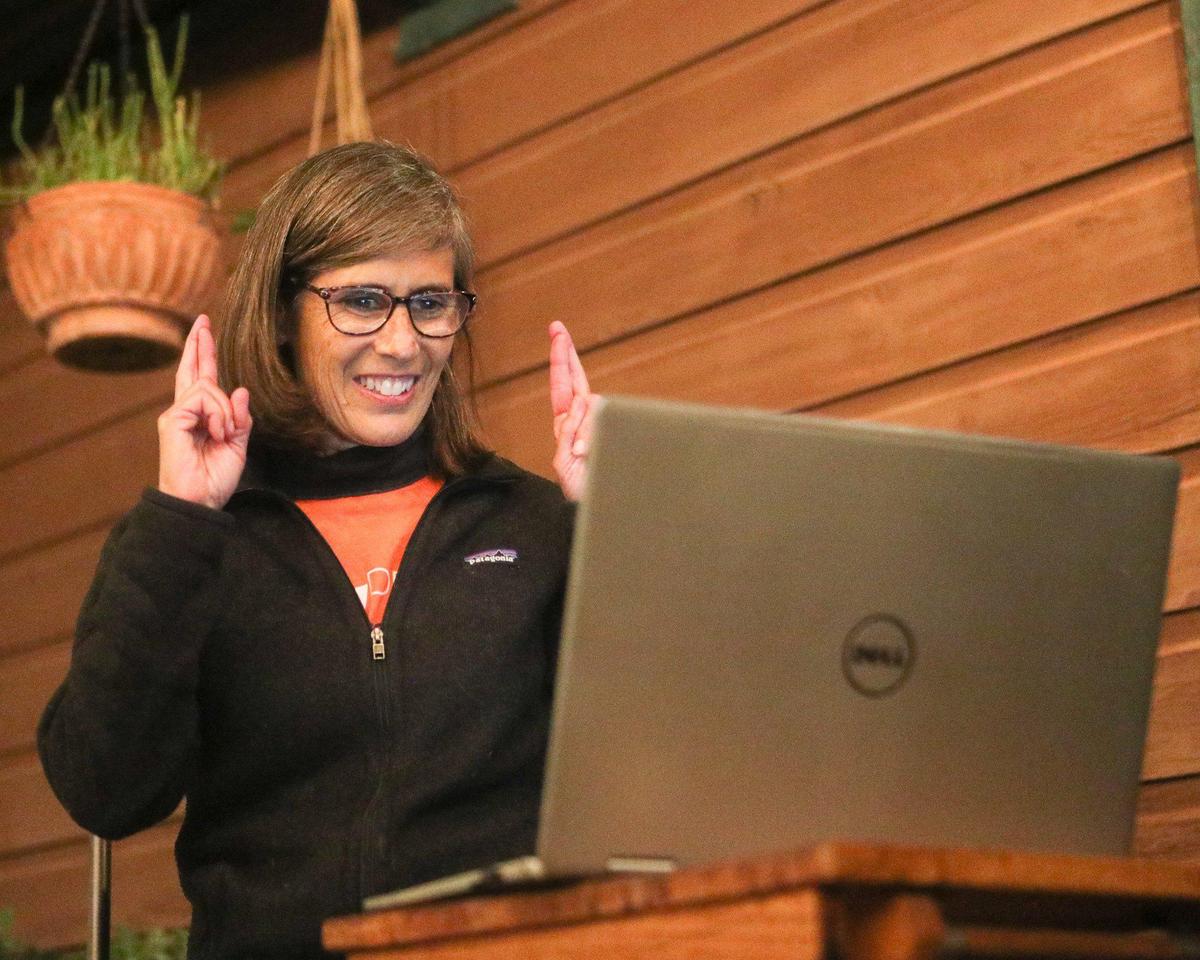 Leader in unofficial final returns San Luis Obispo city council member Andy Pease has her fingers crossed as she talks to family over the computer.